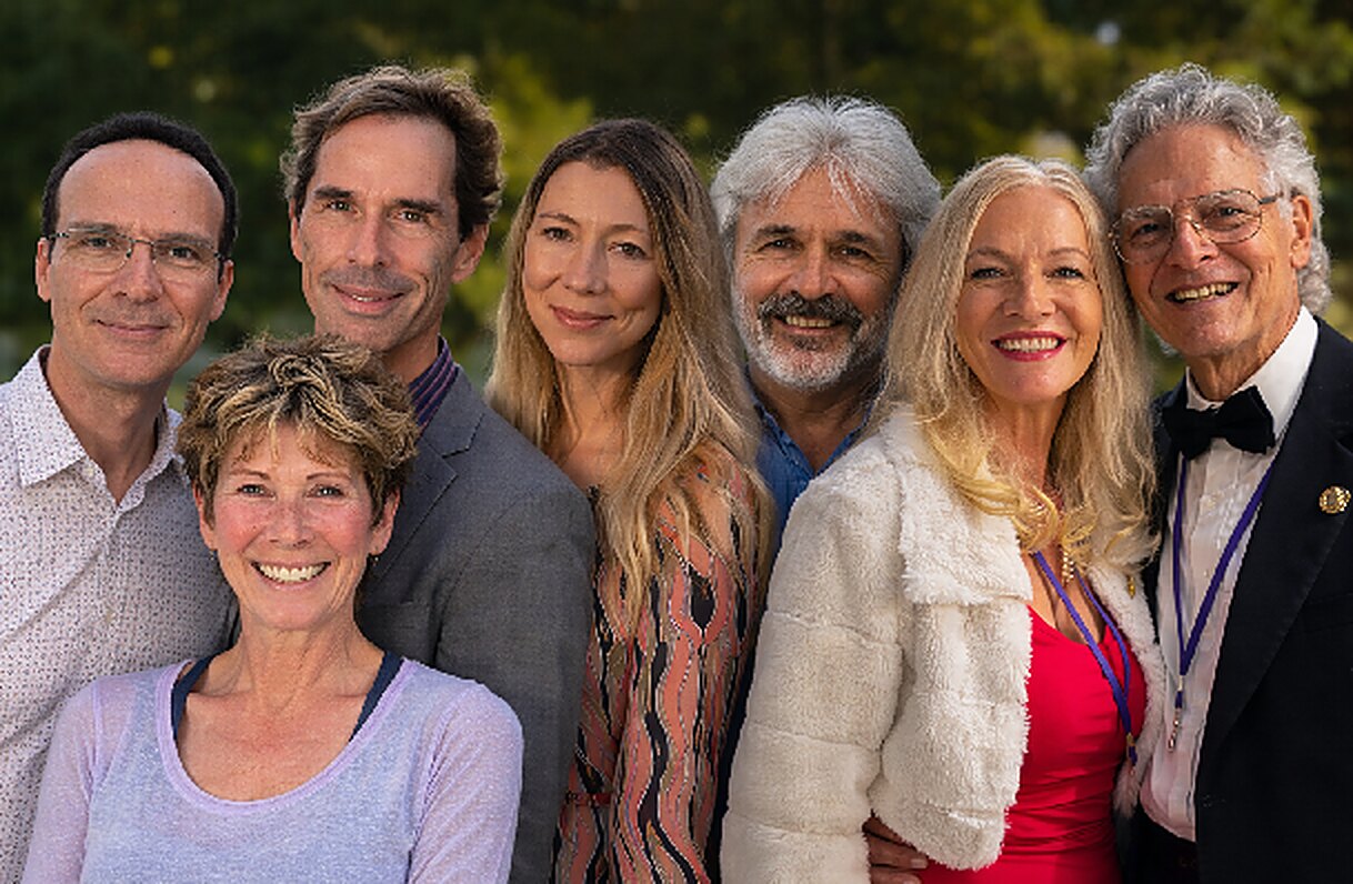 A group of people together in warm sunlight